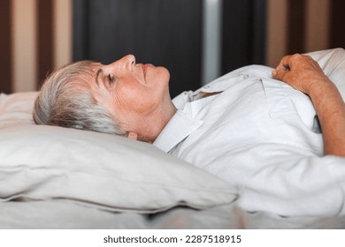 Sleepless middle-aged woman lying in bed suffers from insomnia sleep disorder cant sleep till morning, depressed elderly female looking upset thinking about life, health troubles concept - Powered by Shutterstock