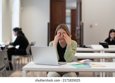 Sleepy adult female student rubbing eyes, feeling tired after studying for long hours in library, exhausted middle-aged woman feeling feel no motivation to study while getting new qualification - Shutterstock ID 2171835025