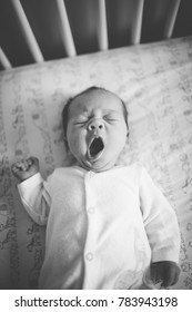 Sleepy Baby Yawning In Crib