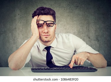 Sleepy Bored Man Employee Sitting At Desk Has No Motivation To Work 