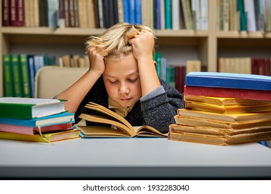 Sleepy Boy Sitting At Table With Books In Library. Tired To Study. Education, Knowledge, Bookstore, Lecture Concept