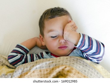 Sleepy Child In The Bed Waking Up Or Getting Sleep. 