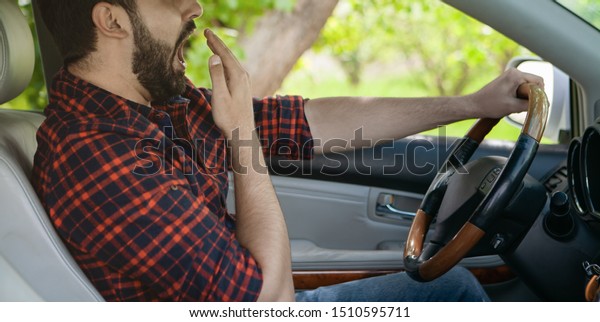 sleepy driver driving
a car. social issue