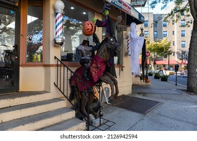 Sleepy Hollow, New York USA - October 19 2021: Headless Horseman Halloween Decorations At A Barbershop In Downtown Sleepy Hollow New York