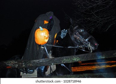 Sleepy Hollow, NY, USA October 17 The Headless Horseman Shows Off His Pumpkin Head During A Halloween Celebration In Sleepy Hollow, New York, Where The Legend Was Created