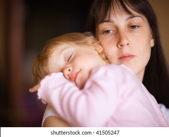 Sleepy Little Child With Mom - Shallow DOF, Focus On Woman's Eyes