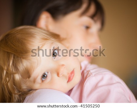 Sleepy little child with mom - shallow DOF, focus on eyes