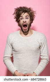 Sleepy Man With Disheveled And Uncombed Long Hair With Beard On Scared Face In White Underwear On Pink Background, Morning And Wake Up, Nightmare, Barbershop