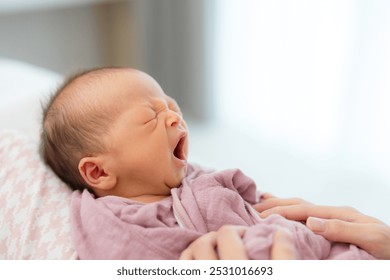 Sleepy newborn baby boy yawn at home  - Powered by Shutterstock