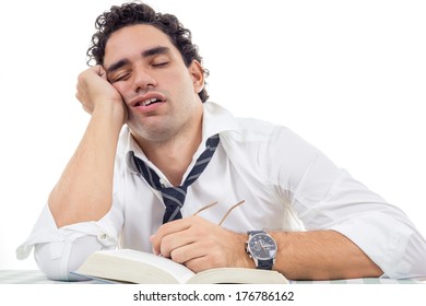 sleepy and tired man with glasses in white shirt and tie sitting with book