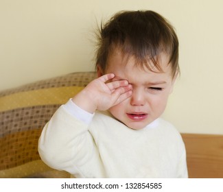 Sleepy Toddler Child Crying In A Bed After Waking Up Or Before Going To Sleep.