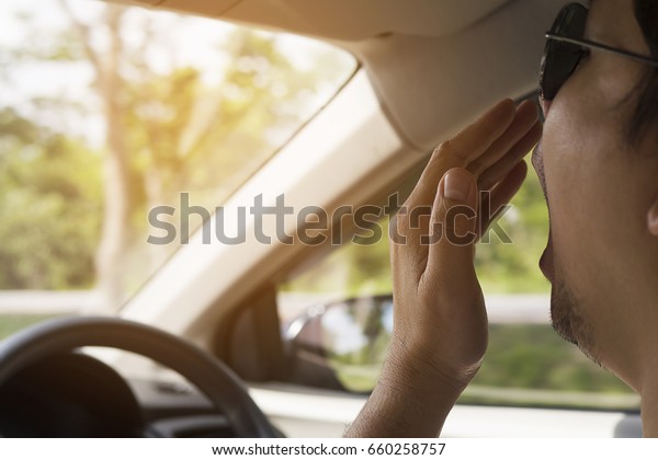 Sleepy yawning man driving a\
car 
