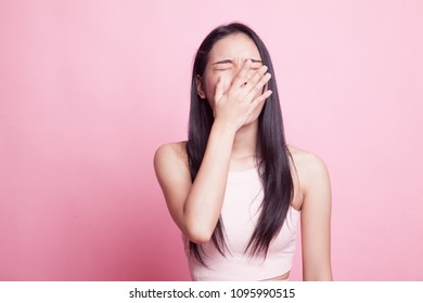 Sleepy Young Asian Woman Yawn On Pink Background