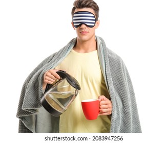 Sleepy Young Man Pouring Water From Electric Kettle In Cup On White Background