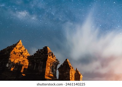 Sleman, Indonesia - July 14,  2015. Milky Way galaxy stretches in the sky Sleman with the foreground of the ijo temple - Powered by Shutterstock