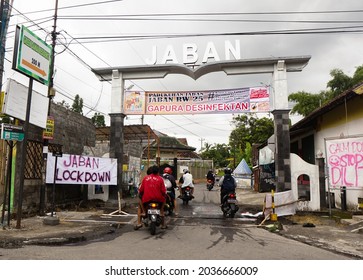Sleman, Indonesia - March 30, 2020 : Residents Enter Disinfectant Gate Installed At The Entrance Of Jaban Village, Sleman, In Response To The Lockdown In The Initial Wave Of Covid-19