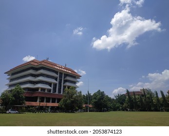 Sleman,Yogyakarta, Indonesia - Sept 24, 2021 : rectorate building Yogyakarta National Development University (UPN) - blue sky background with white clouds