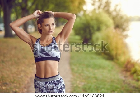 Similar – Image, Stock Photo Fit muscular woman working out in a park