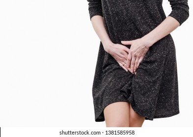 Slender Girl In A Dark Dress Experiences Discomfort In The Uterus, Pain, Hands Between Her Legs. Incontinence, Need To Pee In The Toilet.