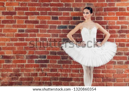 slender girl in stylish outfit looking aside indoors, close up photo, copy space