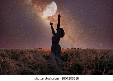 Slender girl turns to the universe