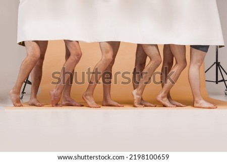 Similar – Unrecognizable diverse barefooted women in bath towels