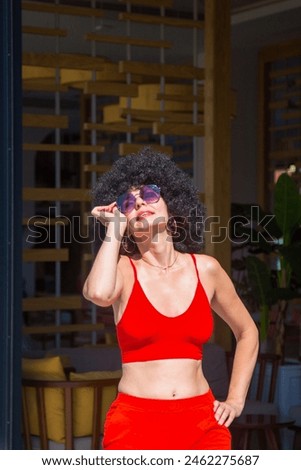 Similar – Brunette surfer woman in bikini standing with surfboard