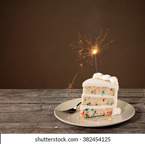Slice of Birthday Cake with sparkler