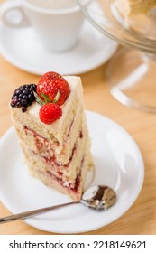 Slice Of Blackberry And Strawberry Pie On A Plate.