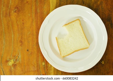  slice bread bite on white plate