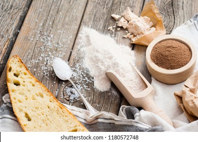slice of bread and ingredients on old weathered wooden table