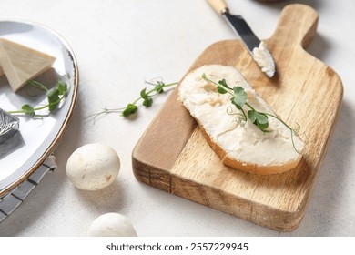 Slice of bread with tasty processed cheese, micro green and mushrooms on light table