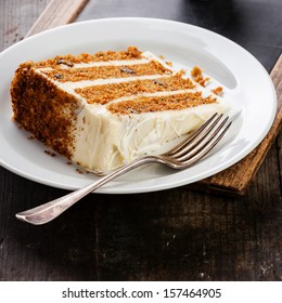 Slice of carrot cake on vintage slate chalk board background - Shutterstock ID 157464905