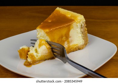 Slice Of Cheese Cake Top With Carmel And A Fork