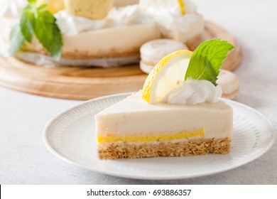 Slice Of Cheesecake With Lemon Filling Decorated With Macarons And Flowers. Healthy Organic Summer Dessert Pie. 