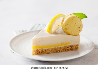 Slice Of Cheesecake With Lemon Filling Decorated With Macarons And Flowers. Healthy Organic Summer Dessert Pie. 