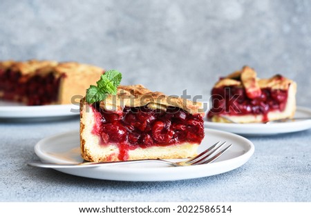 slice of cherry pie on the kitchen table. Fruit pie. Tart.