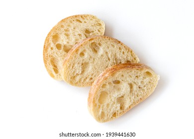 Slice of Chiabata bread isolated on white background, top view. Sliced Italian ciabatta. - Shutterstock ID 1939441630