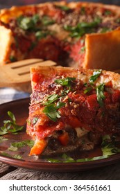 Slice Of Chicago Deep Dish Pizza Macro On A Plate On The Table. Vertical
