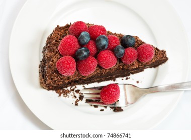 Slice Of Chocolate Cake With Berries - View From Above