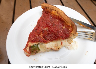 A Slice Of Classic Chicago Deep Dish Pizza.