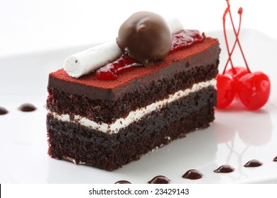 A Slice Of Delicious Black Forest Cake, Garnished With All The Goodies