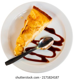 Slice Of Delicious Cheesecake With Shortcrust Pasty Topped With Layer Of Ripe Apples Served On Plate With Balsamic Glaze. Isolated Over White Background.