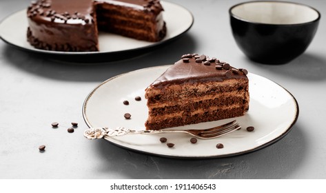 A slice of delicious chocolate cake.  Layered chocolate cake . - Shutterstock ID 1911406543