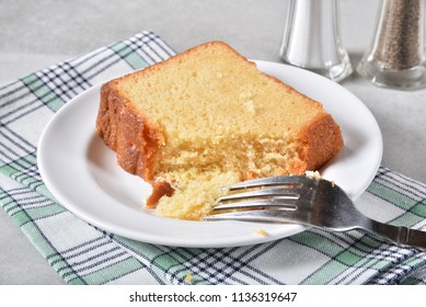 Slice Of Delicious Pound Cake With A Missing Bite