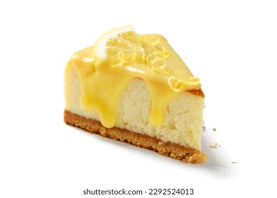 Slice of fresh baked homemade lemon cheesecake with lemon curd and lemon slices. isolated on white background