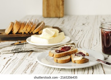 Slice Of Fresh Bread With Butter And Jam On Table