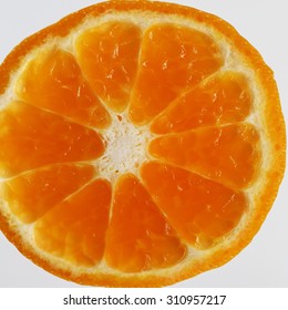 Slice of fresh orange and its peel.
