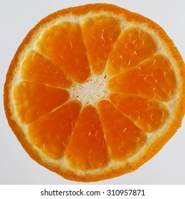 Slice of fresh orange and its peel.