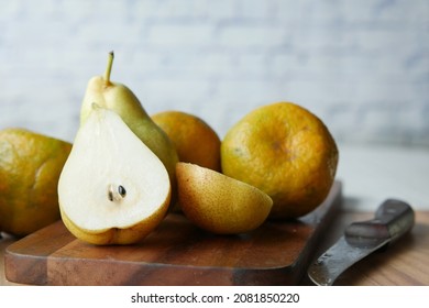 slice of fresh pears on table close up 